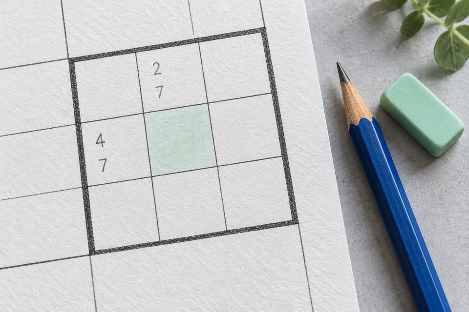 Illustration of small pencil candidates in Sudoku cells beside a blue pencil and mint eraser.